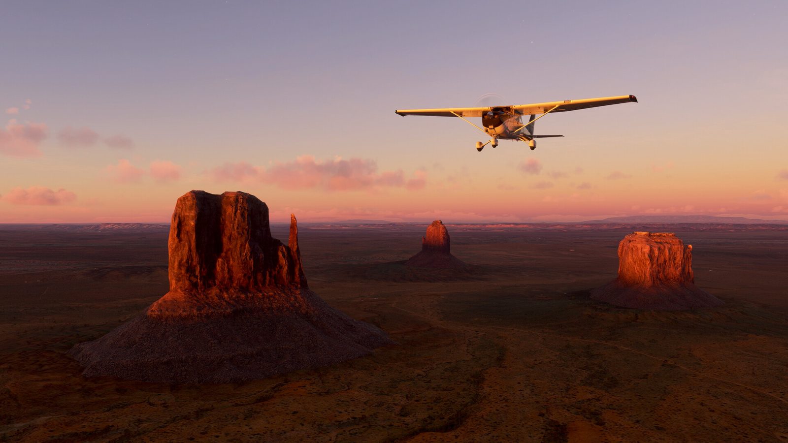 In the sim: a bush plane over Monument Valley at sunset