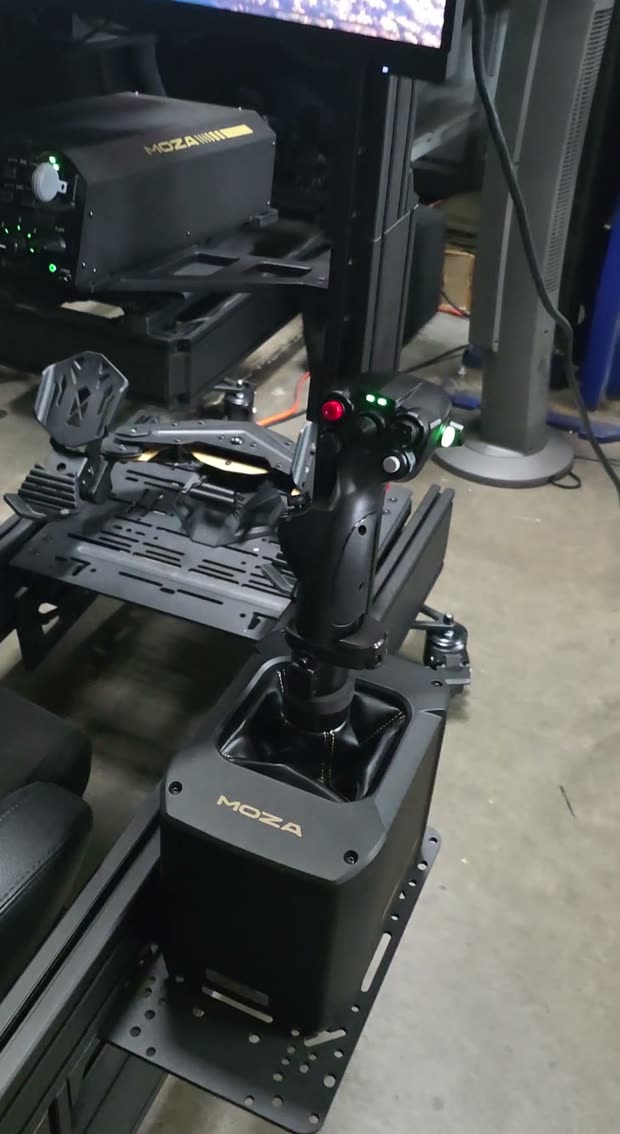 The flight stick and rudder pedals on the lounge flight sim